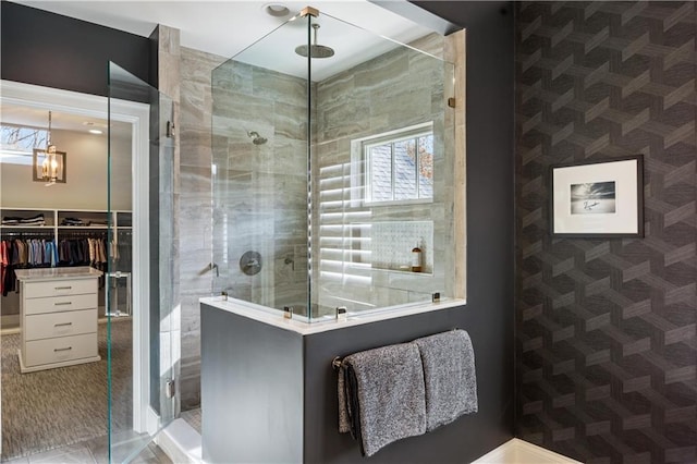 bathroom with a tile shower