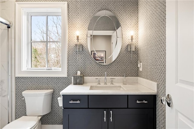 bathroom featuring vanity and toilet