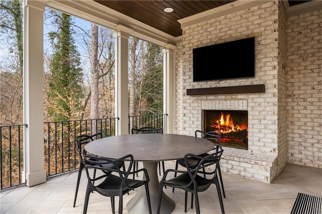 view of patio with an outdoor brick fireplace