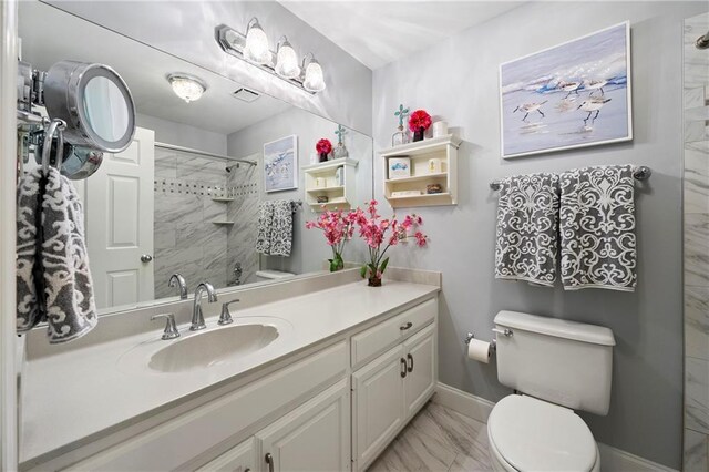 1703 Brandywine Ct, Atlanta, GA 30338 - bathroom with marble look tile flooring, vanity, a shower, toilet, and baseboards