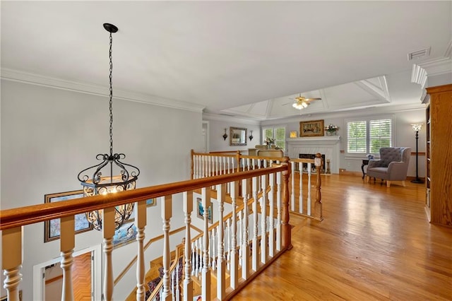 1703 Brandywine Ct, Atlanta, GA 30338 - corridor featuring an upstairs landing, a chandelier, crown molding, and light wood-style flooring
