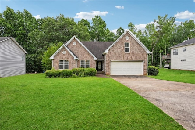 605 Pebble Blvd, Covington, GA 30016 - view of front of house featuring brick siding, driveway, a front lawn, and an attached garage