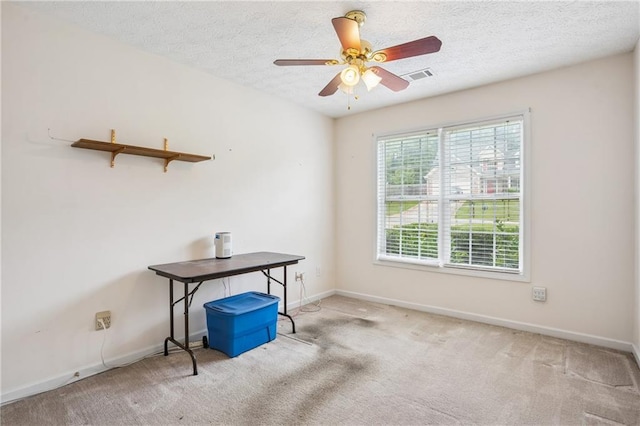 605 Pebble Blvd, Covington, GA 30016 - spare room with ceiling fan, a textured ceiling, baseboards, and carpet flooring