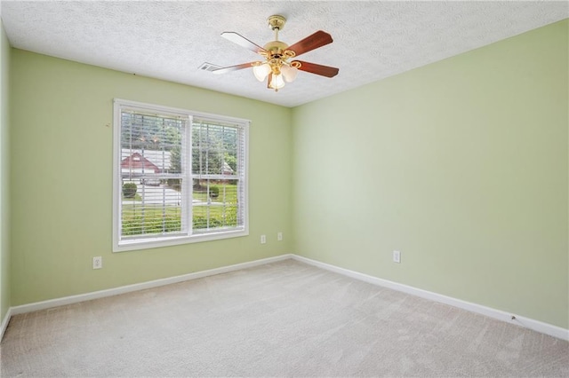 605 Pebble Blvd, Covington, GA 30016 - empty room featuring baseboards, light carpet, ceiling fan, and a textured ceiling