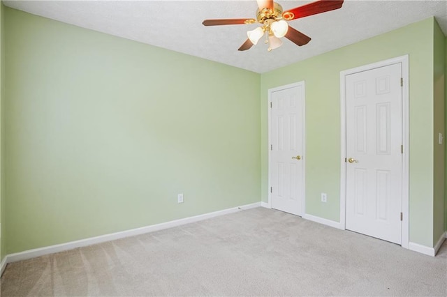 605 Pebble Blvd, Covington, GA 30016 - unfurnished bedroom featuring light carpet, baseboards, and ceiling fan