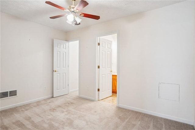 605 Pebble Blvd, Covington, GA 30016 - unfurnished bedroom featuring light colored carpet, baseboards, and connected bathroom