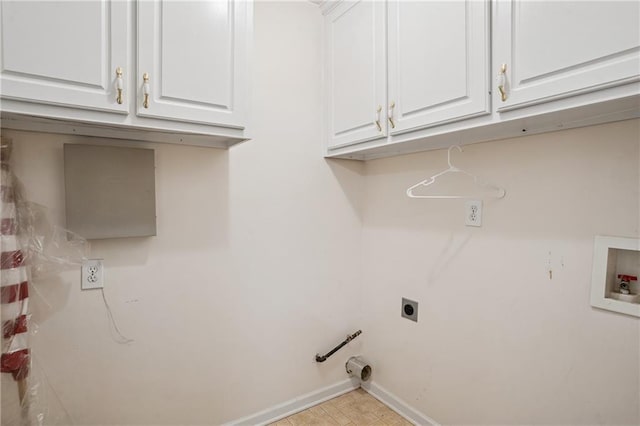 605 Pebble Blvd, Covington, GA 30016 - washroom with cabinet space, hookup for an electric dryer, washer hookup, and baseboards