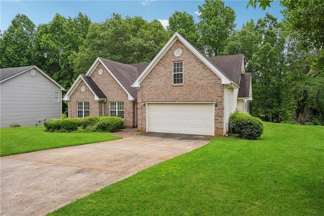 605 Pebble Blvd, Covington, GA 30016 - traditional-style home featuring driveway, brick siding, and a front lawn