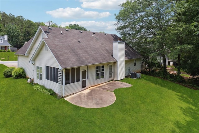 605 Pebble Blvd, Covington, GA 30016 - back of house with a patio, a sunroom, a shingled roof, a chimney, and a lawn