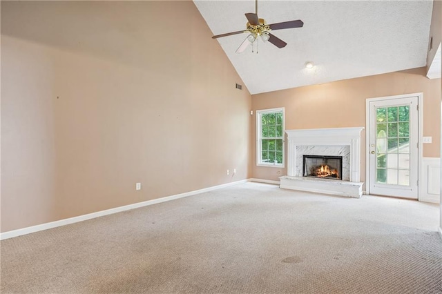 605 Pebble Blvd, Covington, GA 30016 - unfurnished living room featuring carpet floors, high vaulted ceiling, a ceiling fan, and plenty of natural light