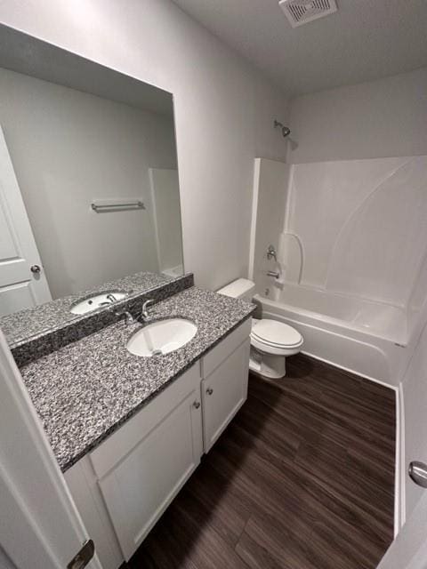 543 Courthouse Park Dr, Temple, GA 30179 - full bath featuring vanity, washtub / shower combination, and wood finished floors