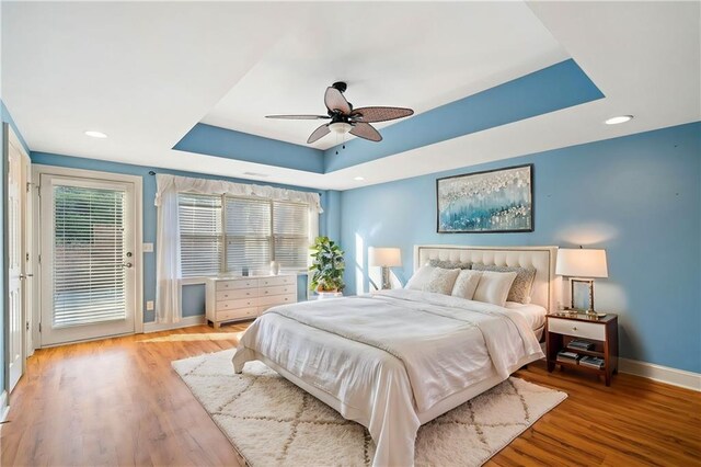 unfurnished living room featuring a fireplace, light hardwood / wood-style floors, high vaulted ceiling, and built in features