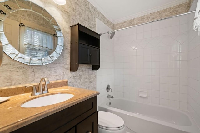 full bathroom featuring vanity, tiled shower / bath combo, crown molding, tile walls, and toilet