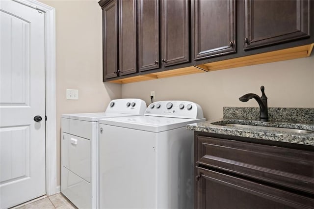 161 Archstone Sq, Mcdonough, GA 30253 - laundry room with cabinet space, separate washer and dryer, and light tile patterned floors