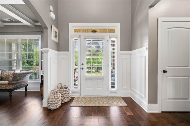 161 Archstone Sq, Mcdonough, GA 30253 - foyer entrance featuring a decorative wall, dark wood-style flooring, and wainscoting