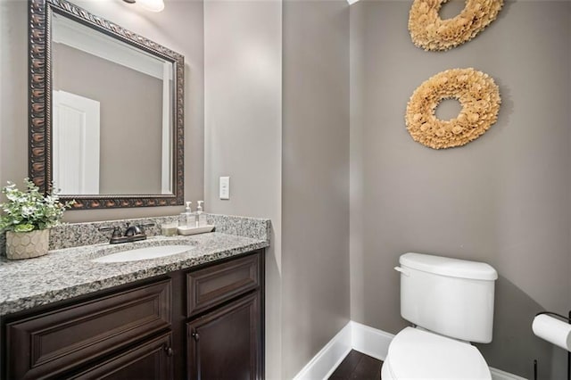 161 Archstone Sq, Mcdonough, GA 30253 - half bath featuring baseboards, toilet, and vanity