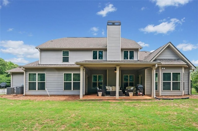 161 Archstone Sq, Mcdonough, GA 30253 - back of property with ceiling fan, an outdoor living space, a patio, a chimney, and central AC
