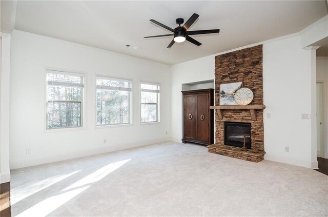 unfurnished living room with light carpet, a fireplace, and ceiling fan