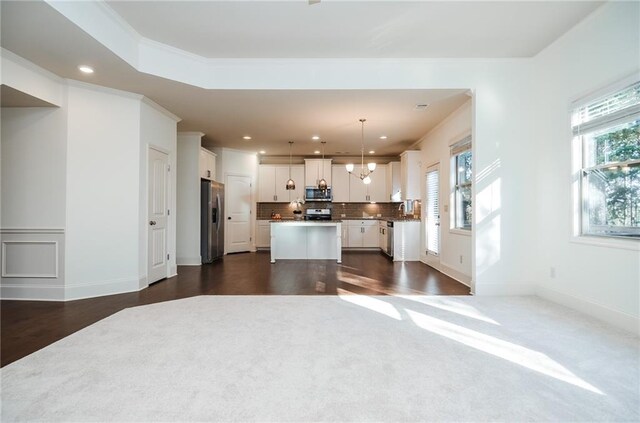 carpeted living room with a fireplace and ceiling fan