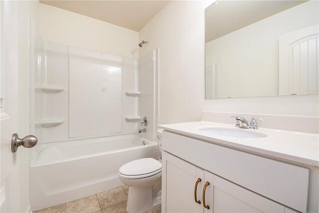 full bathroom featuring toilet, tile patterned flooring, vanity, and shower / bathtub combination