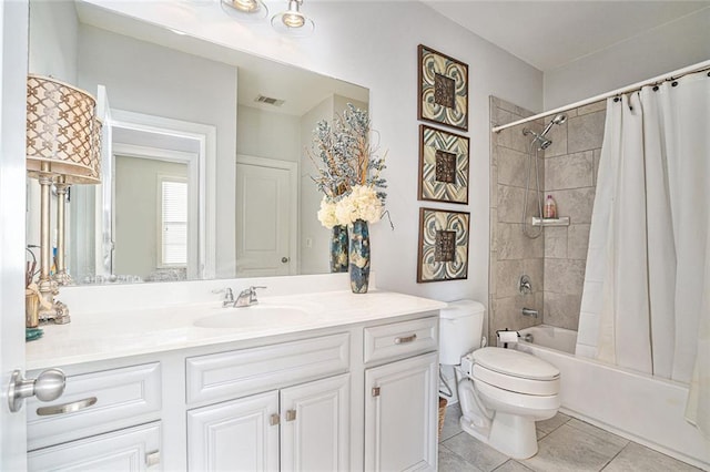 full bathroom with tile patterned floors, vanity, shower / bath combination with curtain, and toilet