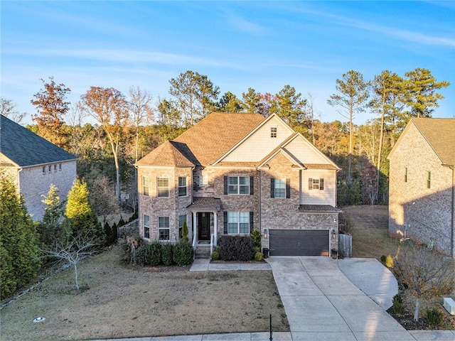 view of front of house with a front lawn and a garage