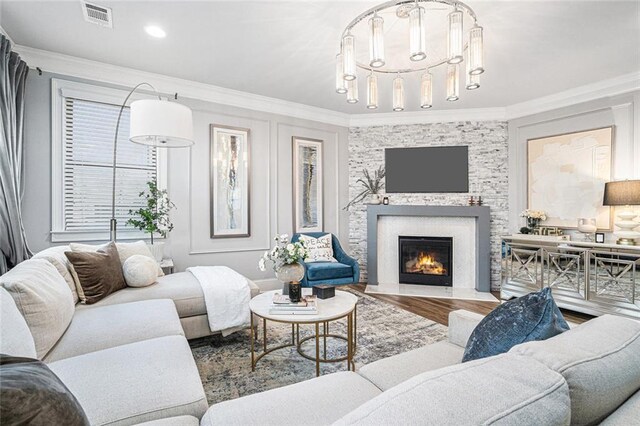 living room with hardwood / wood-style floors and ornamental molding