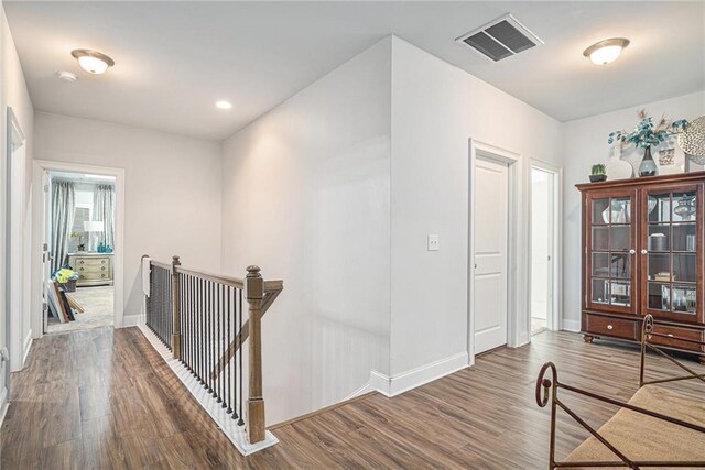 corridor featuring dark hardwood / wood-style floors