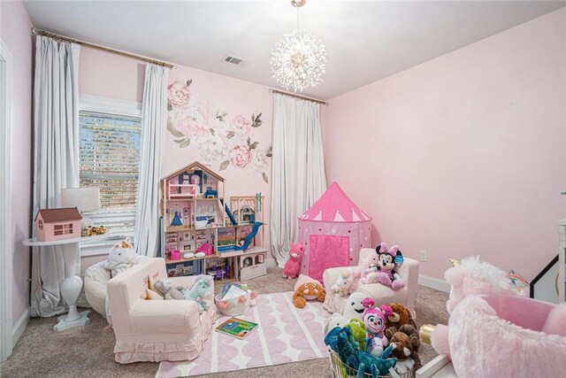 playroom featuring a chandelier and light colored carpet