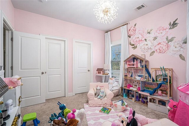 recreation room with a notable chandelier and light colored carpet