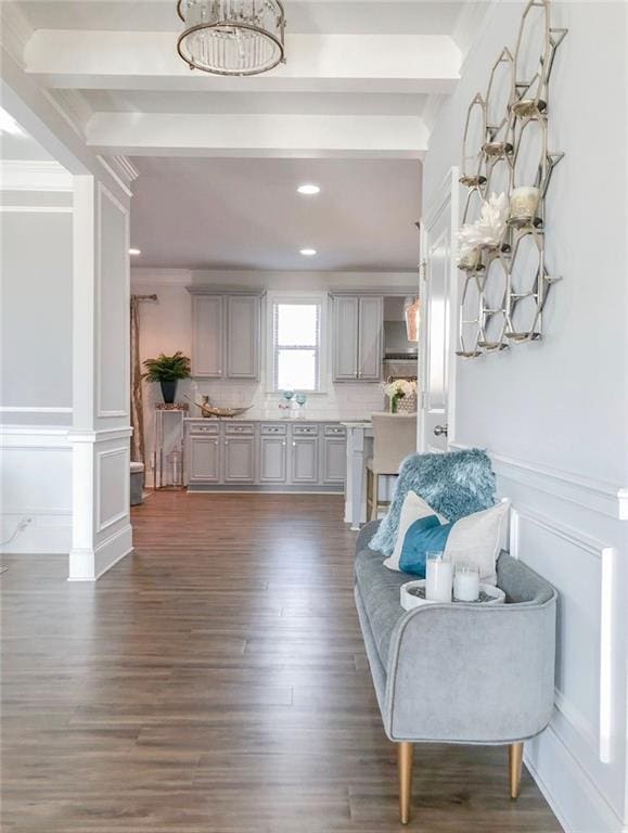 interior space featuring gray cabinetry, dark hardwood / wood-style floors, and beam ceiling