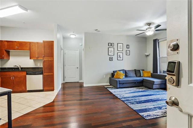 living room featuring ceiling fan and light hardwood / wood-style flooring