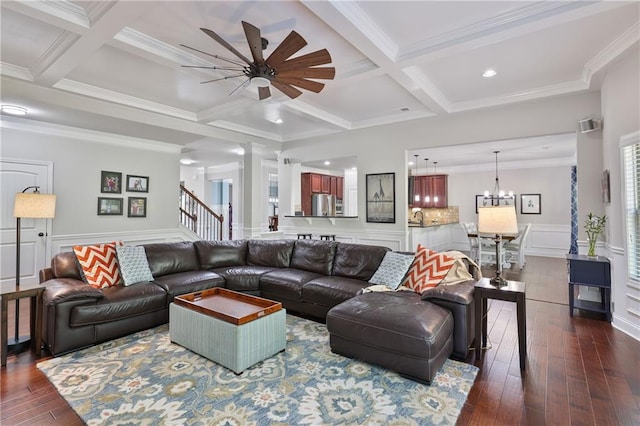 living room with coffered ceiling, beamed ceiling, ceiling fan, dark wood-type flooring, and crown molding