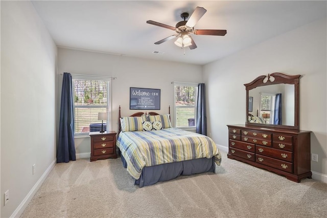 bedroom with carpet floors, baseboards, and a ceiling fan
