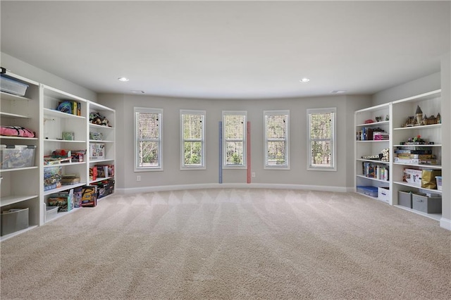 living area with carpet floors, baseboards, and recessed lighting