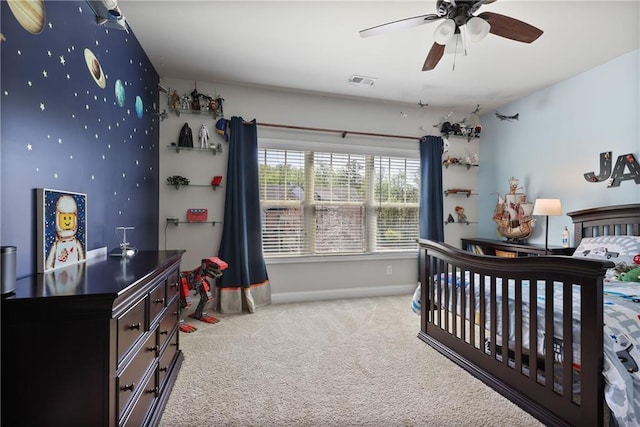 bedroom featuring carpet, baseboards, and ceiling fan