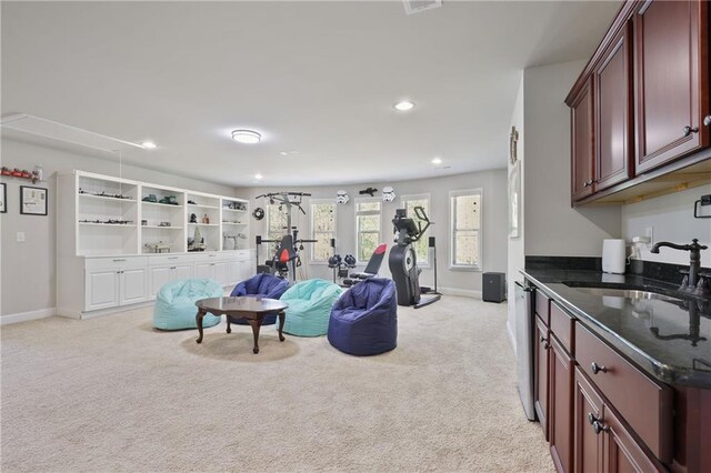 living area featuring light carpet, baseboards, and recessed lighting