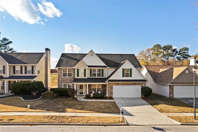 view of front of property featuring a garage and a front lawn