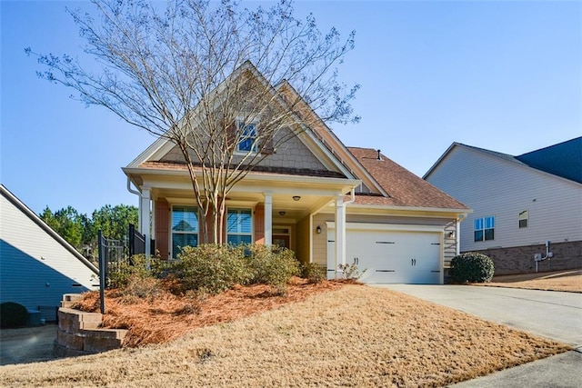 craftsman inspired home featuring concrete driveway and a garage