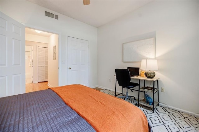 bedroom featuring baseboards, visible vents, and ceiling fan