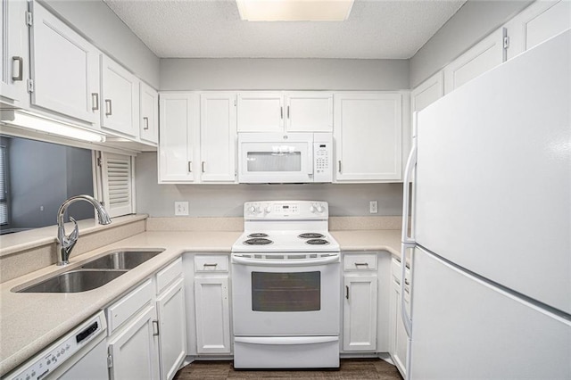 1800 Clairmont Lk Unit 412, Decatur, GA 30033 - kitchen featuring white appliances, a sink, white cabinets, light countertops, and a textured ceiling