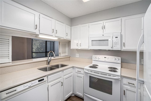 1800 Clairmont Lk Unit 412, Decatur, GA 30033 - kitchen with white appliances, a sink, white cabinets, and a textured ceiling