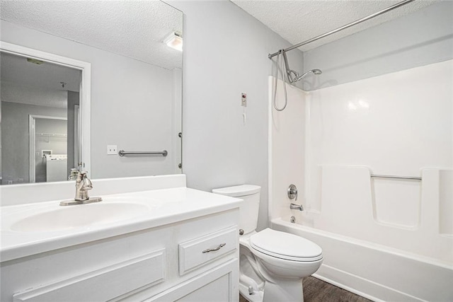 1800 Clairmont Lk Unit 412, Decatur, GA 30033 - bathroom featuring a textured ceiling, vanity, toilet, washtub / shower combination, and wood finished floors