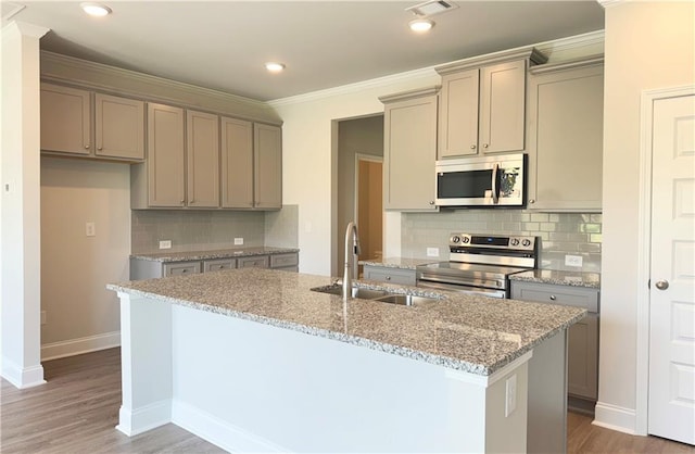 3817 Billabong Trl Unit 104, Gainesville, GA 30506 - kitchen with baseboards, a sink, appliances with stainless steel finishes, a kitchen island with sink, and gray cabinetry