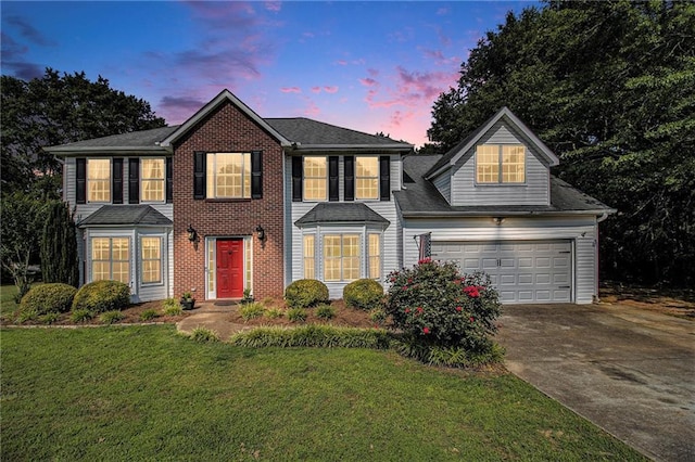 7341 Raleigh Way, Bethlehem, GA 30620 - colonial house with driveway, a garage, a front yard, and brick siding