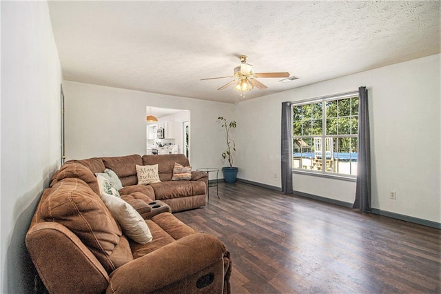 7341 Raleigh Way, Bethlehem, GA 30620 - living area featuring wood finished floors, ceiling fan, and baseboards