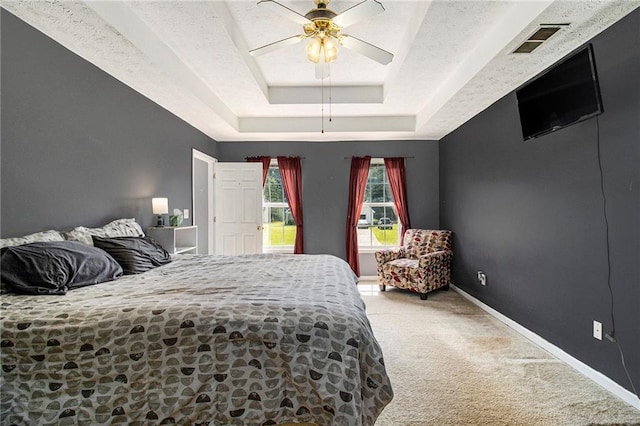 7341 Raleigh Way, Bethlehem, GA 30620 - carpeted bedroom featuring a tray ceiling, ceiling fan, baseboards, and a textured ceiling