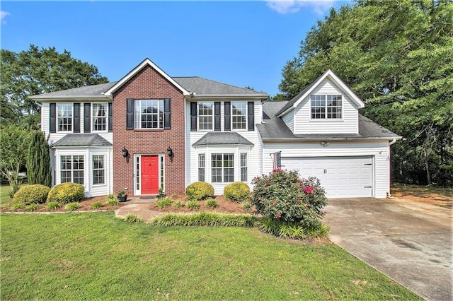 7341 Raleigh Way, Bethlehem, GA 30620 - colonial-style house with concrete driveway, a front yard, and an attached garage