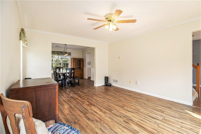 7341 Raleigh Way, Bethlehem, GA 30620 - living area featuring wood finished floors, a ceiling fan, ornamental molding, and baseboards