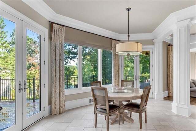 dining area featuring a healthy amount of sunlight, ornamental molding, and french doors